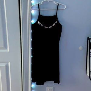 Black dress with fringes on the top of the dress